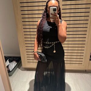Chic Black Sleeveless Dress with Sheer Skirt